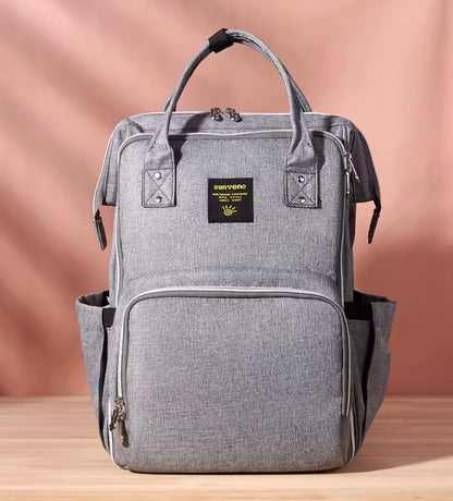 sac à dos à langer gris