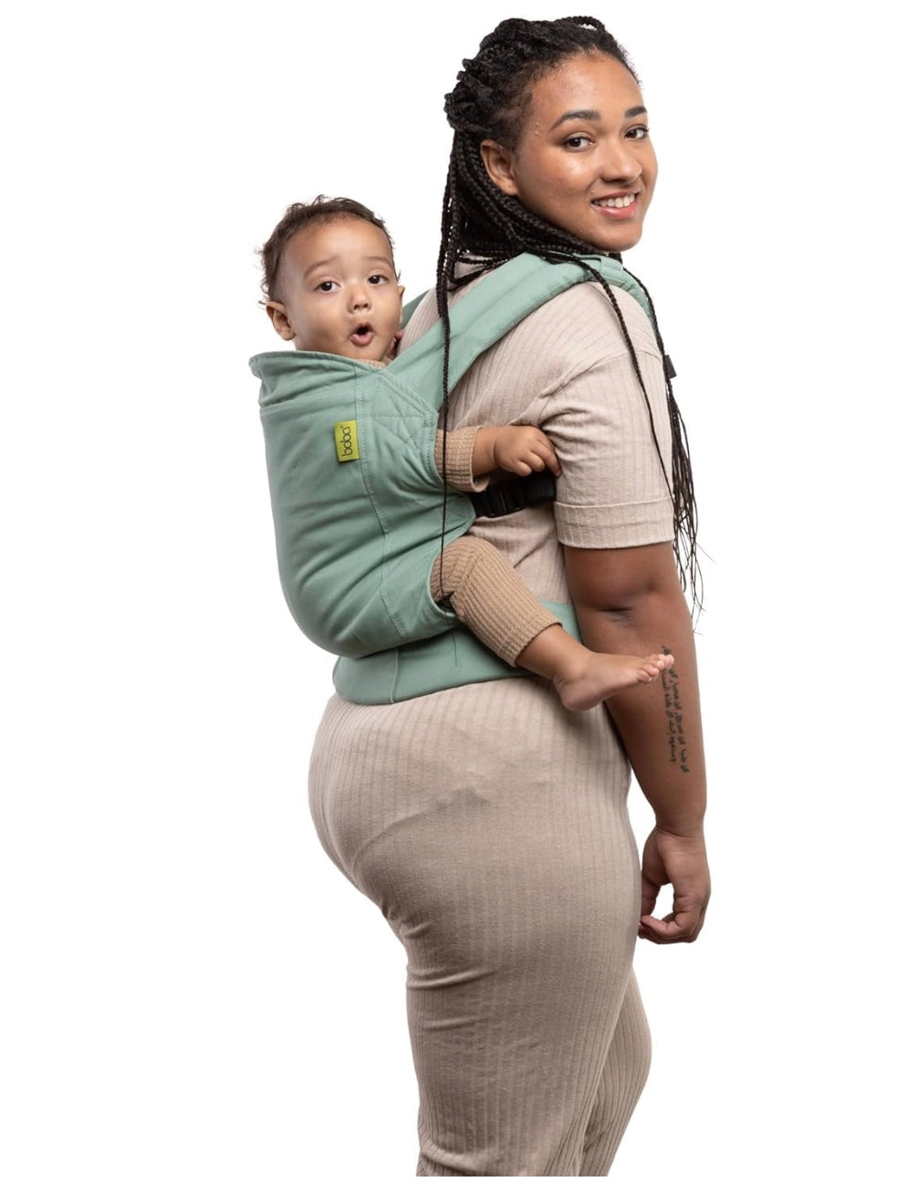 un porte bébé vert 